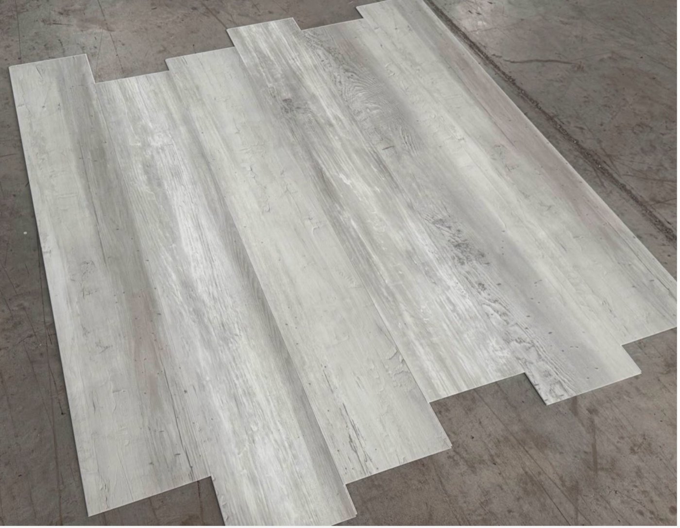 Close view of Coastal Whitewash planks showing the knots and weathering in the print